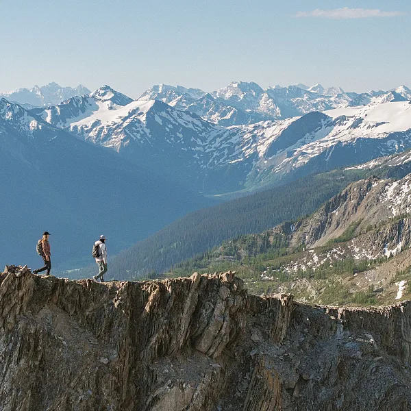 Two friends hiking alongside the glaciers and mountains of Bugaboo Provincial Park during a heli-hiking trip with CMH Bugaboos.