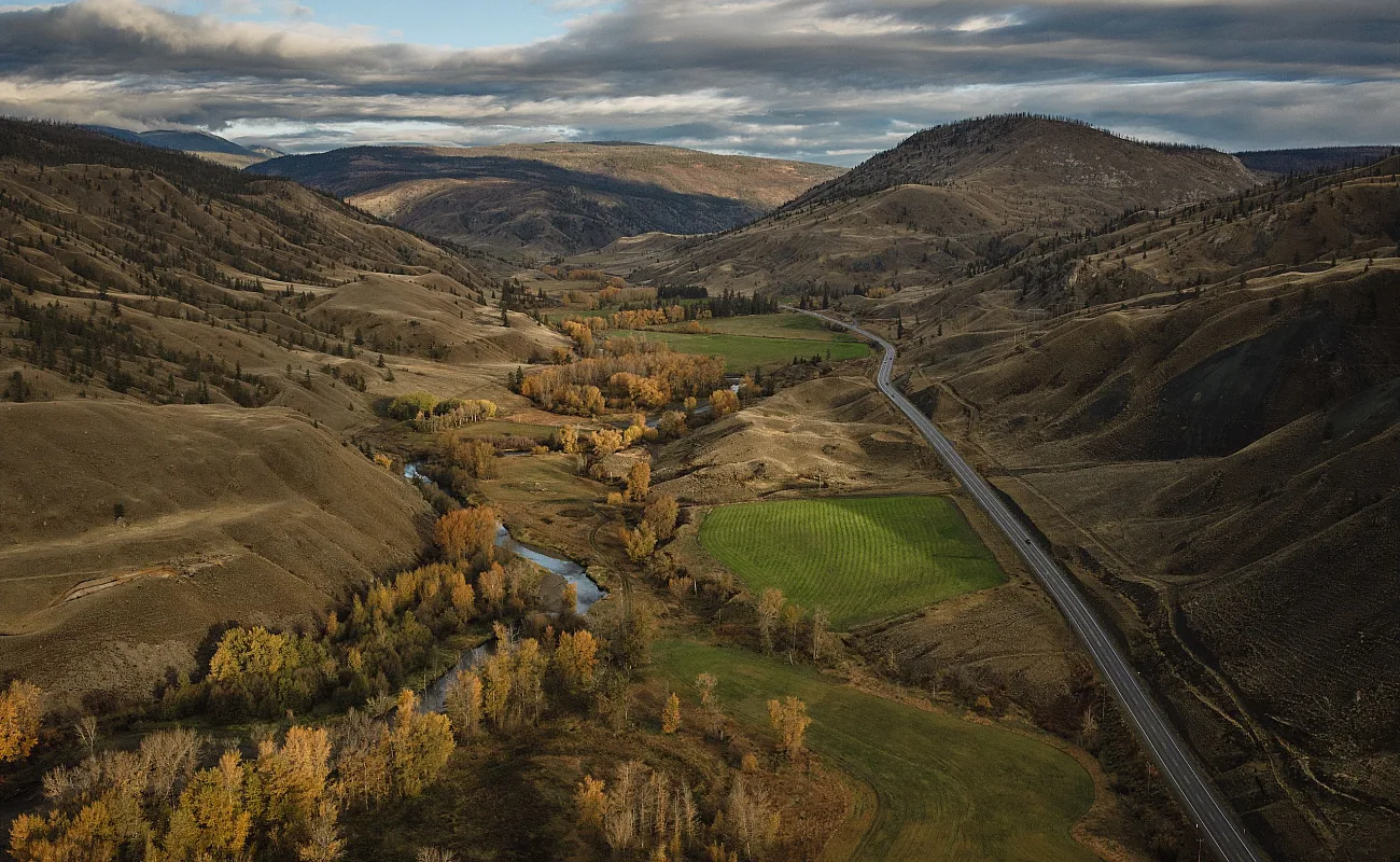 Aerial view of the Painted Hills, with autumn colors and the community of Cache Creek in the valley below.