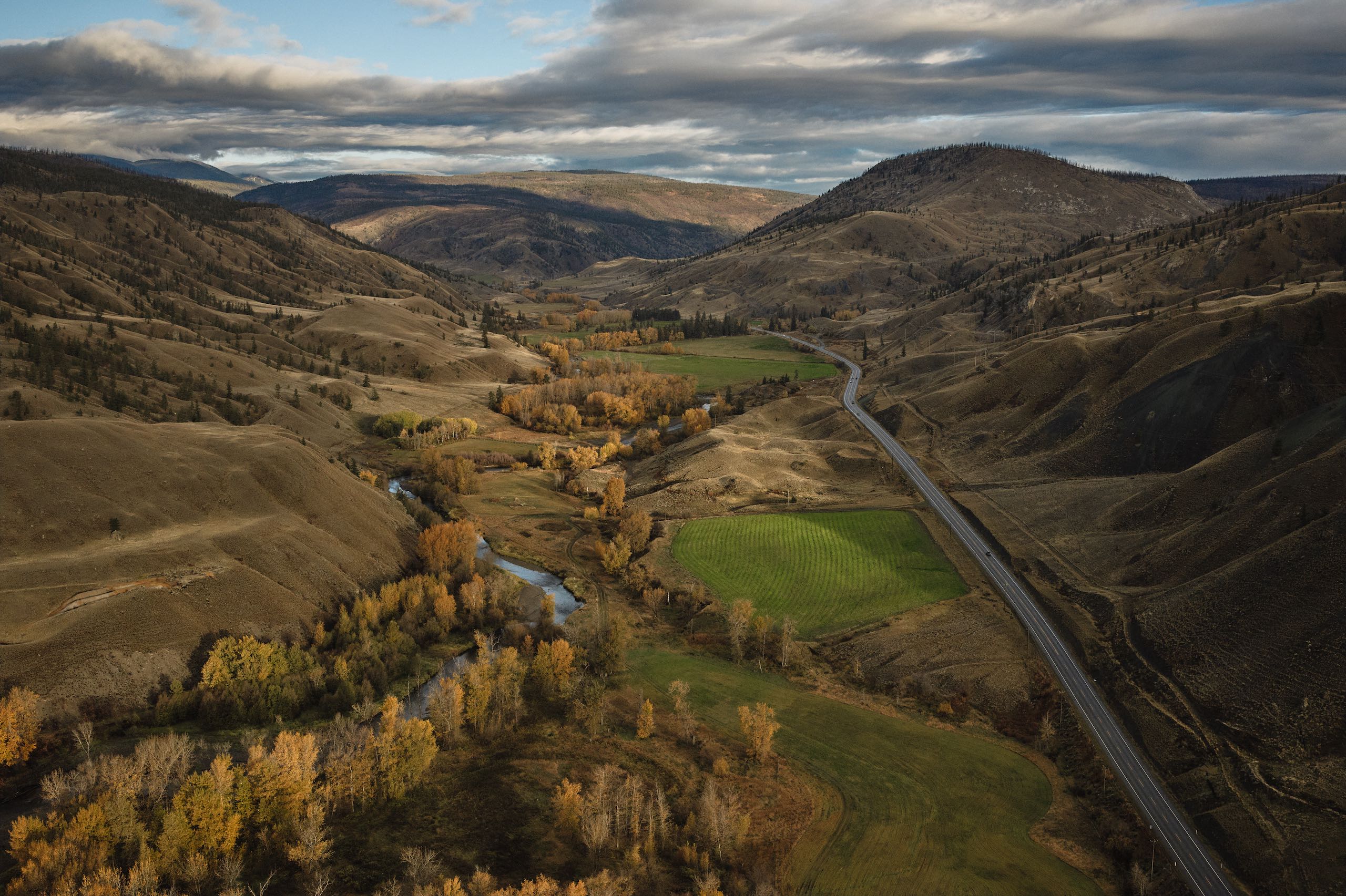 Aerial view of the Painted Hills, with autumn colors and the community of Cache Creek in the valley below.