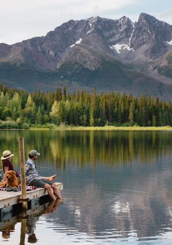 People sitting on a dock on Dennis Lake in Smithers