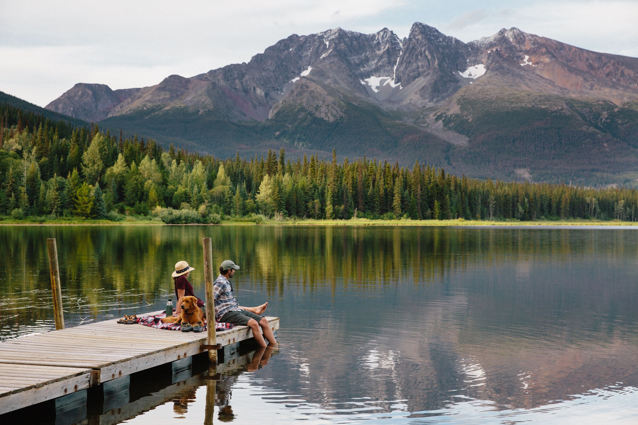 People sitting on a dock on Dennis Lake in Smithers