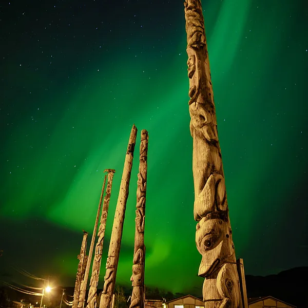 Gitwangak totem poles with Aurora Borealis