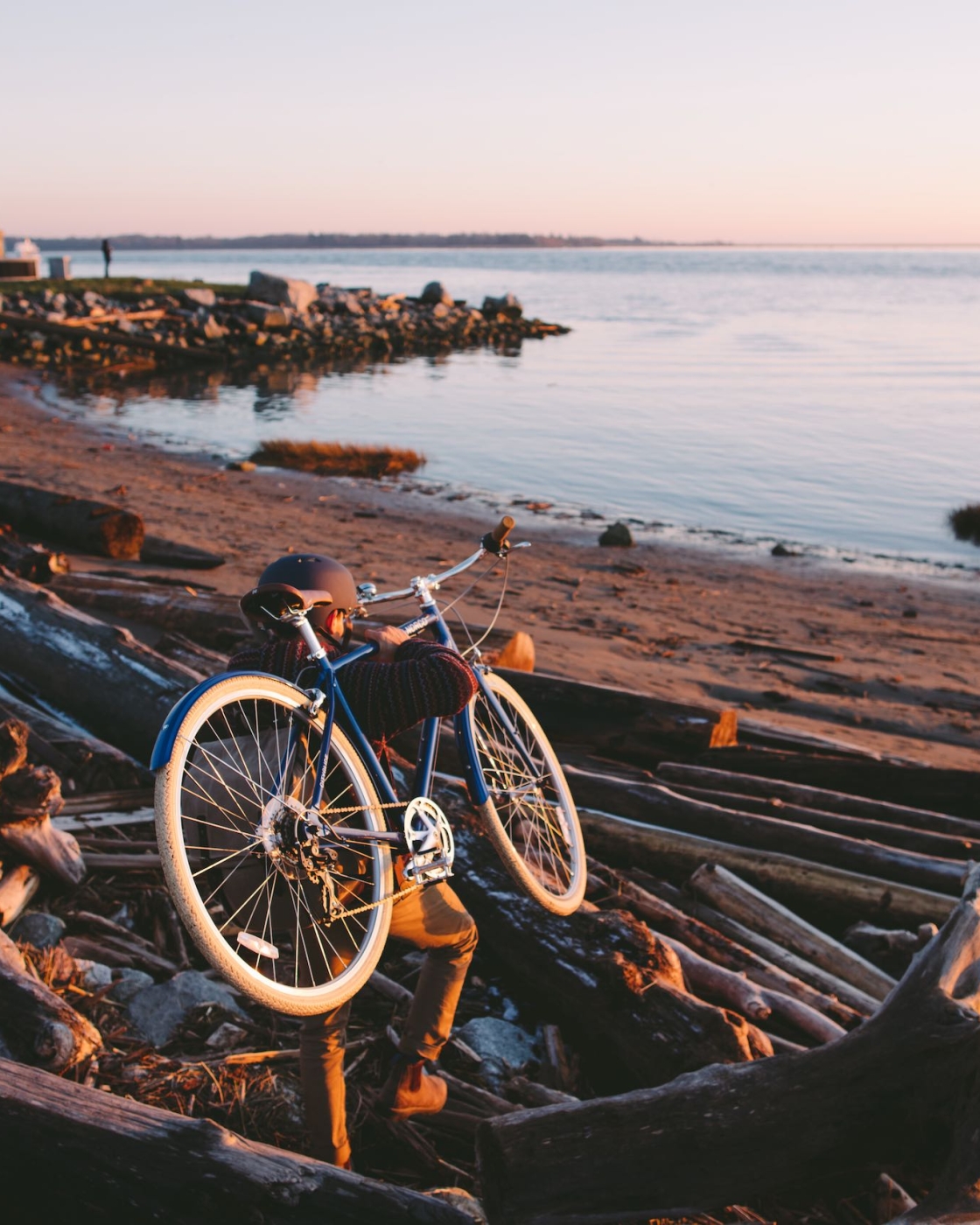 Cyclist carrying bike to the bay in Richmond
