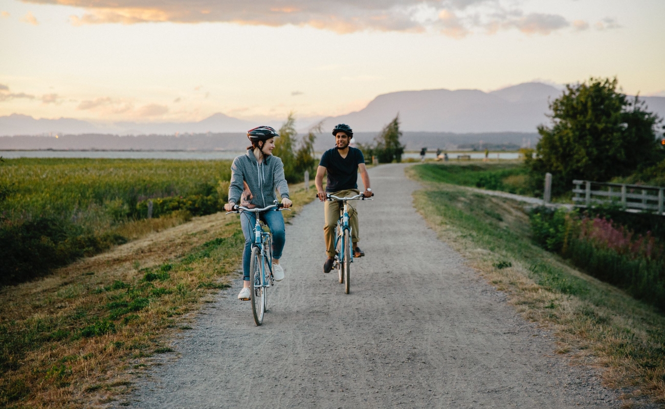 Cyclists on a gravel path in rural Richmond.