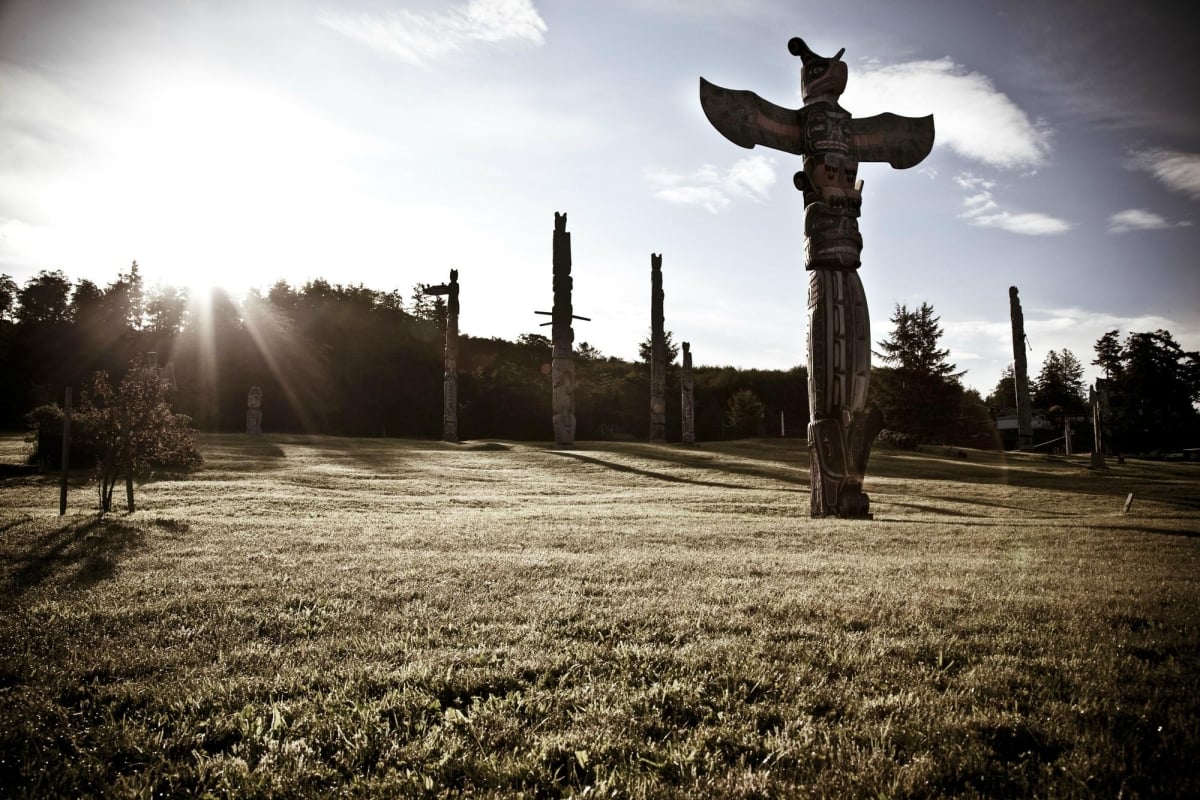 Totem poles in a field