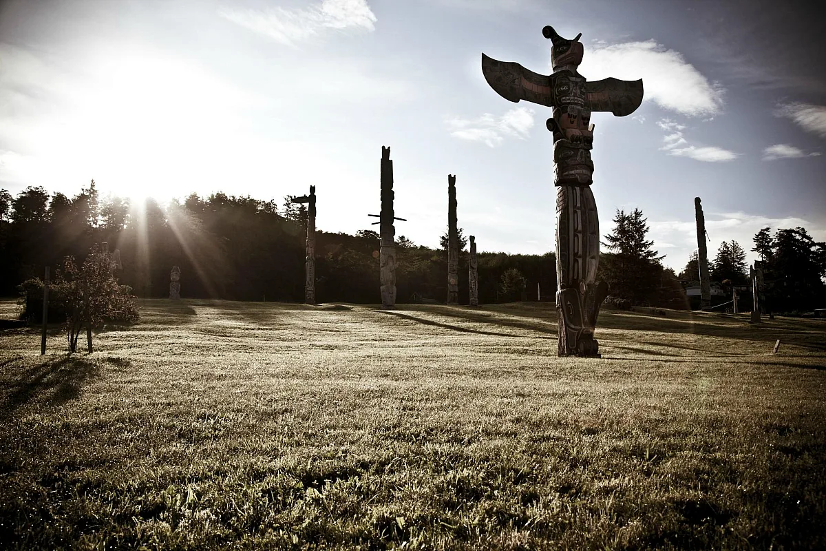 Totem poles in a field