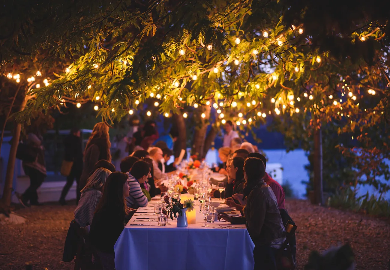 Friends dining at God's Mountain Estate