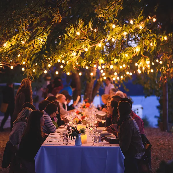 Friends dining at God's Mountain Estate