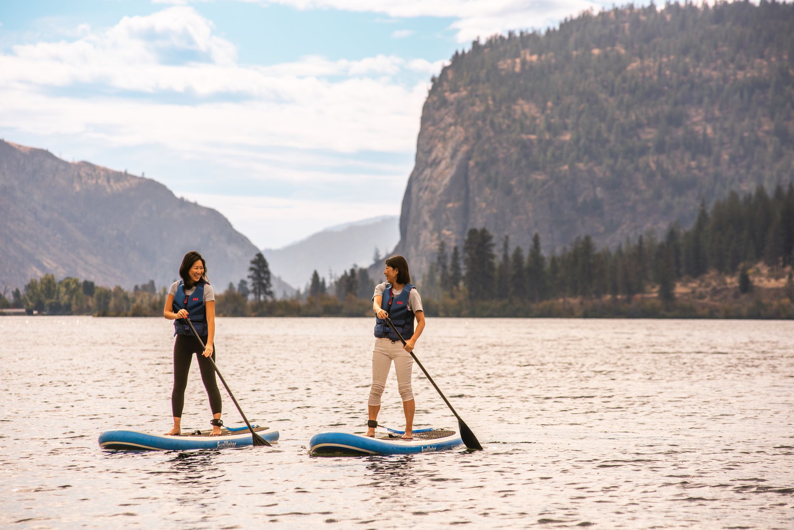 A mother and daughter paddle boarding on Vaseux Lake near Oliver.