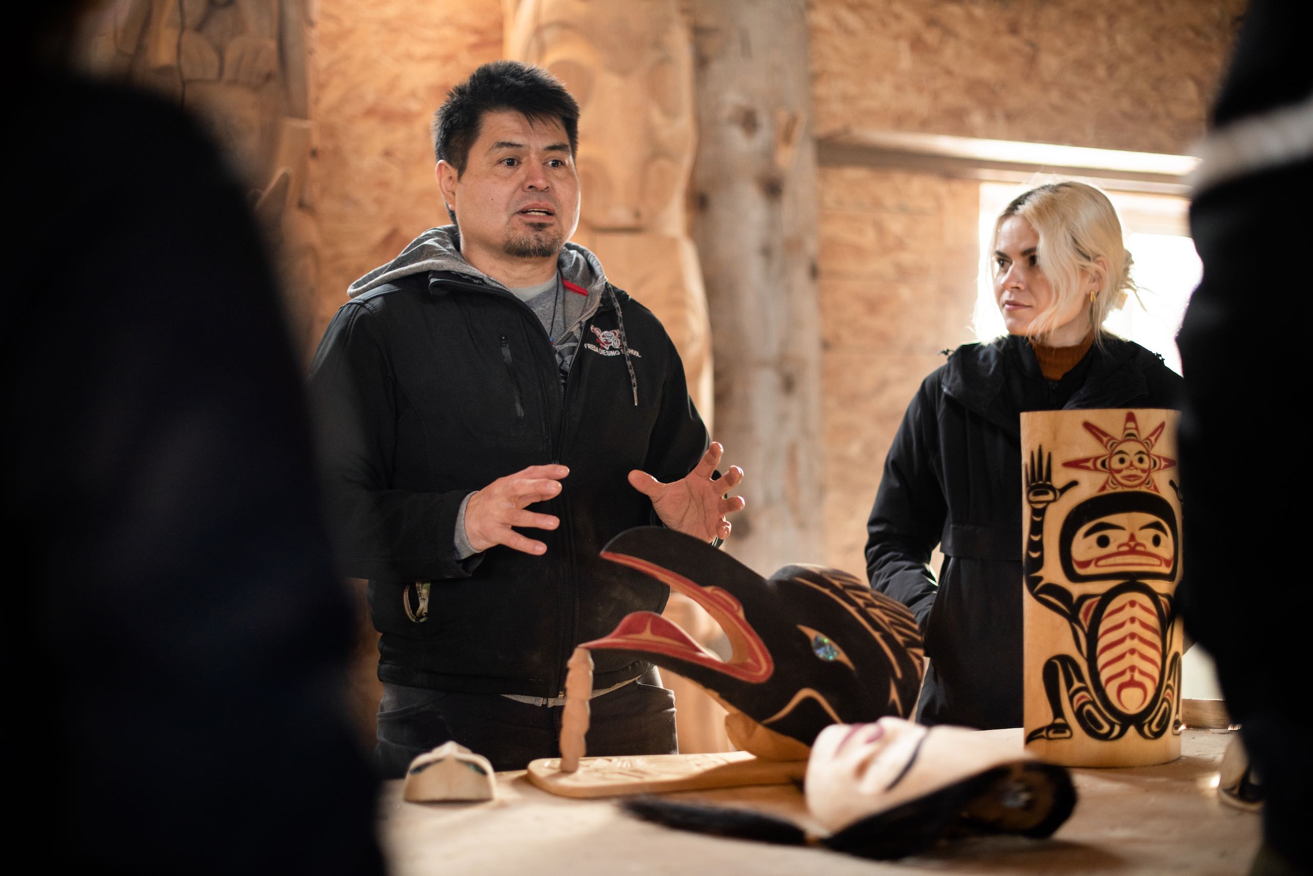 Learning about history and culture of the Nisga'a with carver Calvin McNeil in the Laxgalts'ap Carving Shed.
