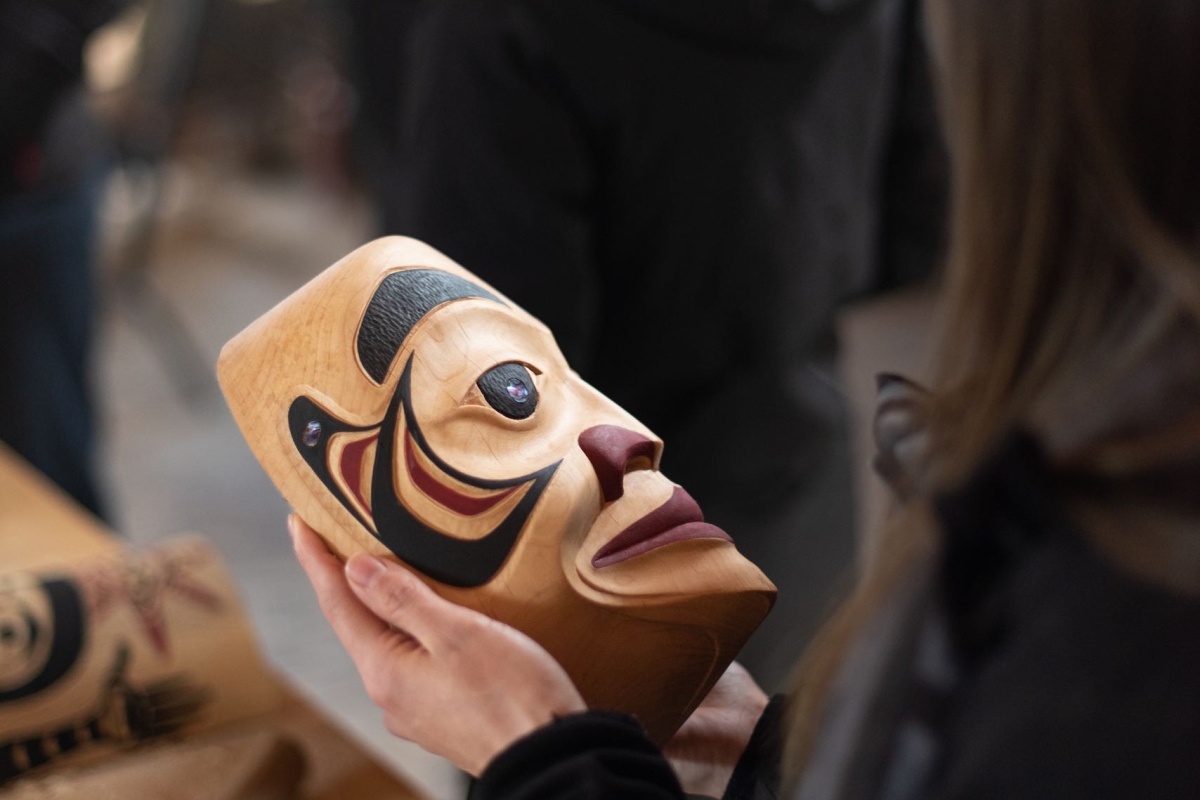 Learning about history and culture of the Nisga'a with carver Calvin McNeil in the Laxgalts'ap Carving Shed.