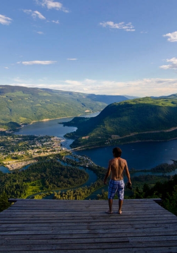 A person enjoying the epic view from the Sicamous Lookout which is a hang gliding launch