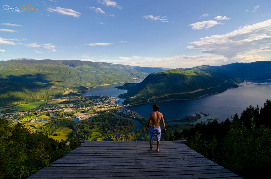 A person enjoying the epic view from the Sicamous Lookout which is a hang gliding launch