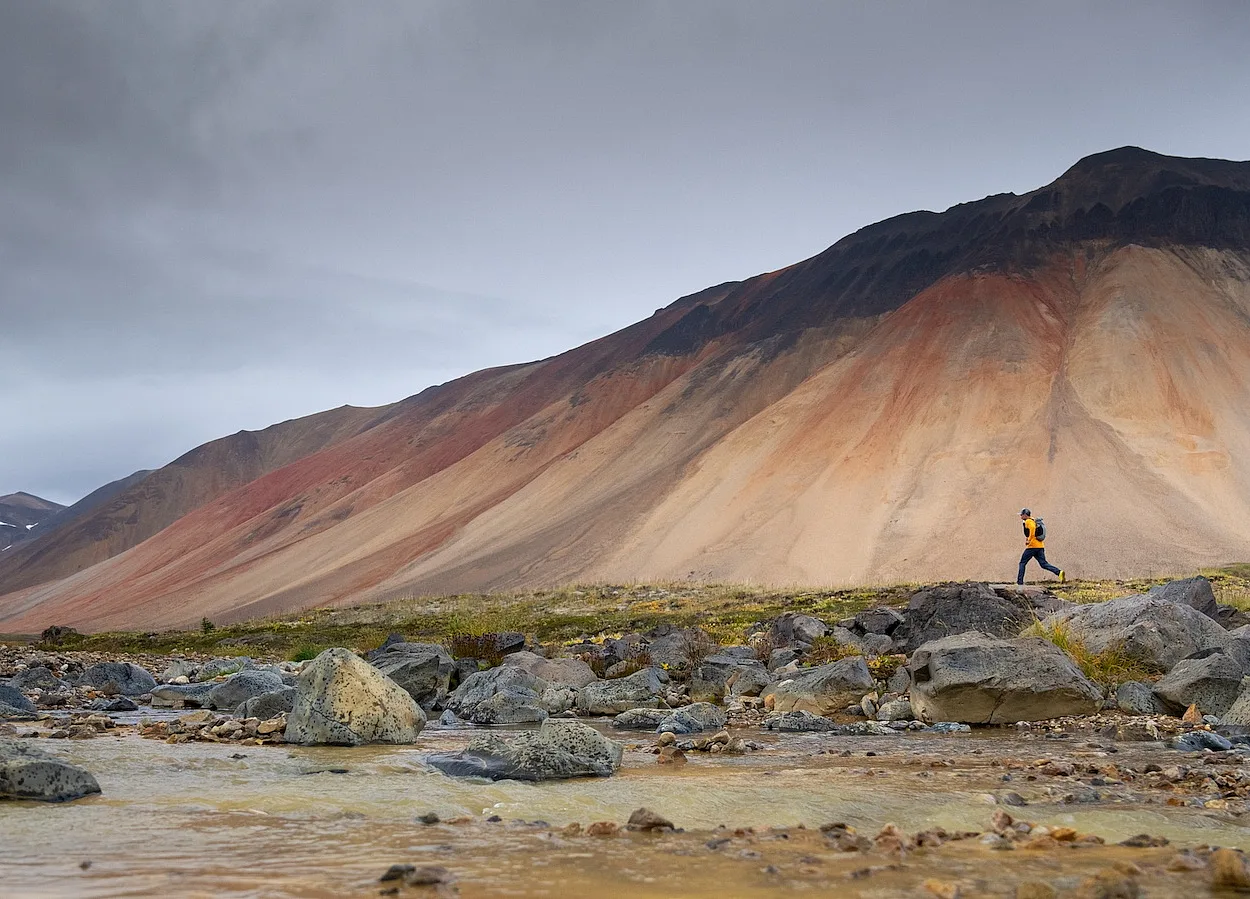 Hikers / trail runners in the Spectrum Range, Mount Edziza Provincial Park.