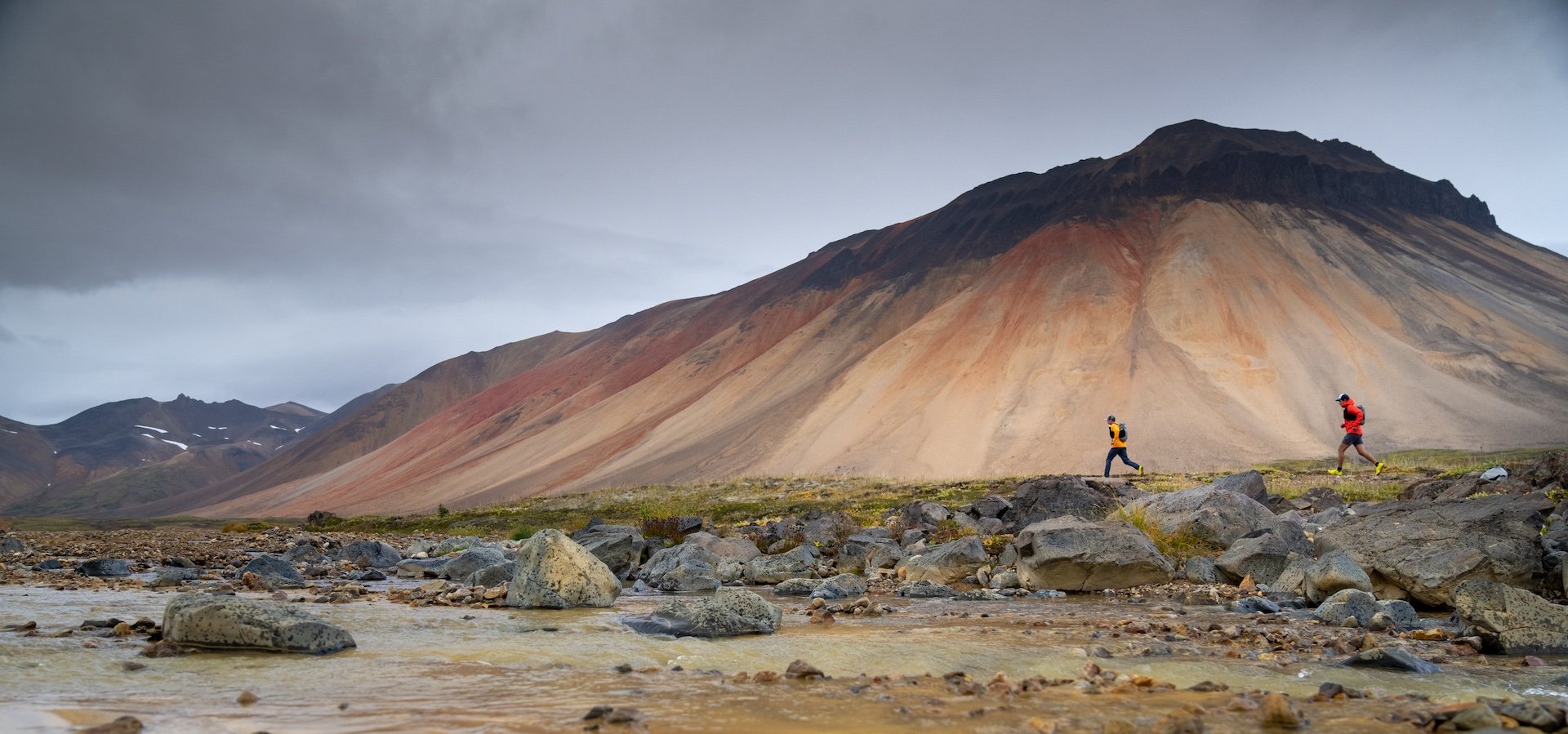 Hikers / trail runners in the Spectrum Range, Mount Edziza Provincial Park.