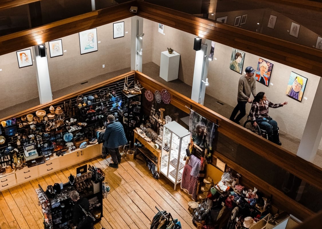 Several people in an art gallery