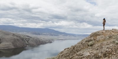 Hiker on Battle Bluff overlooking Kamloops Lake