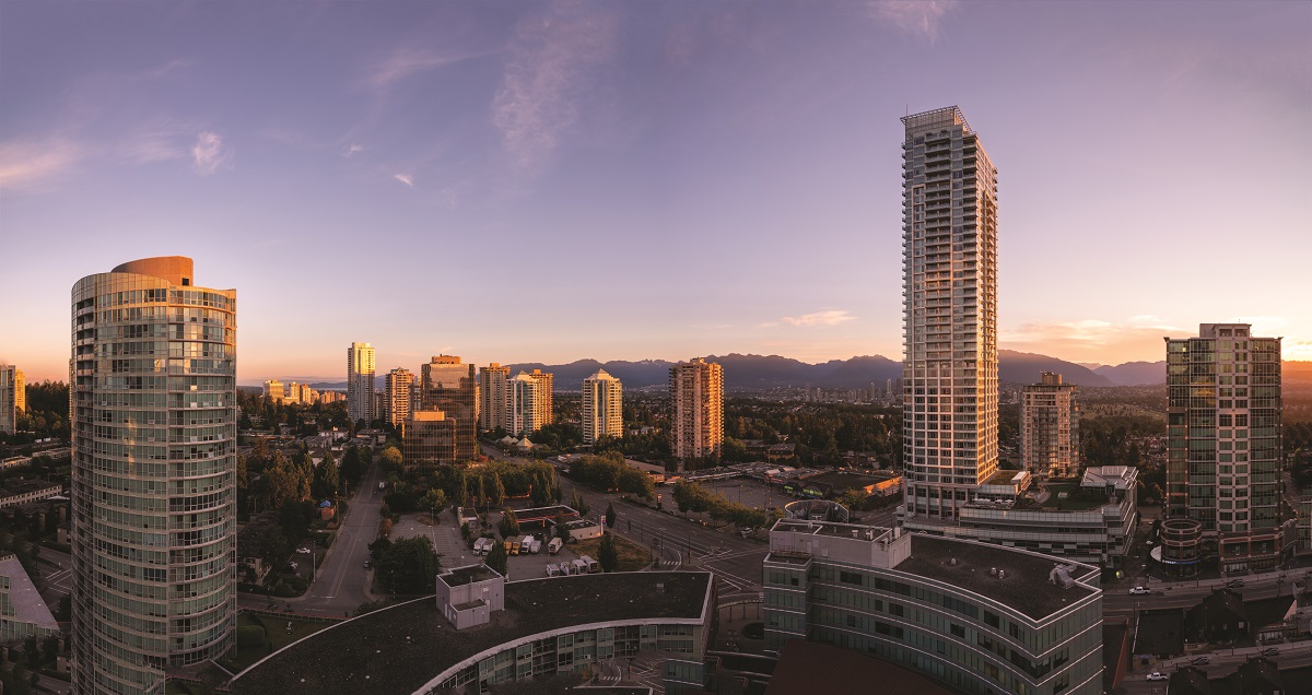 A view of the cityscape in Burnaby, the sky has a tint of purple as the sun sets.