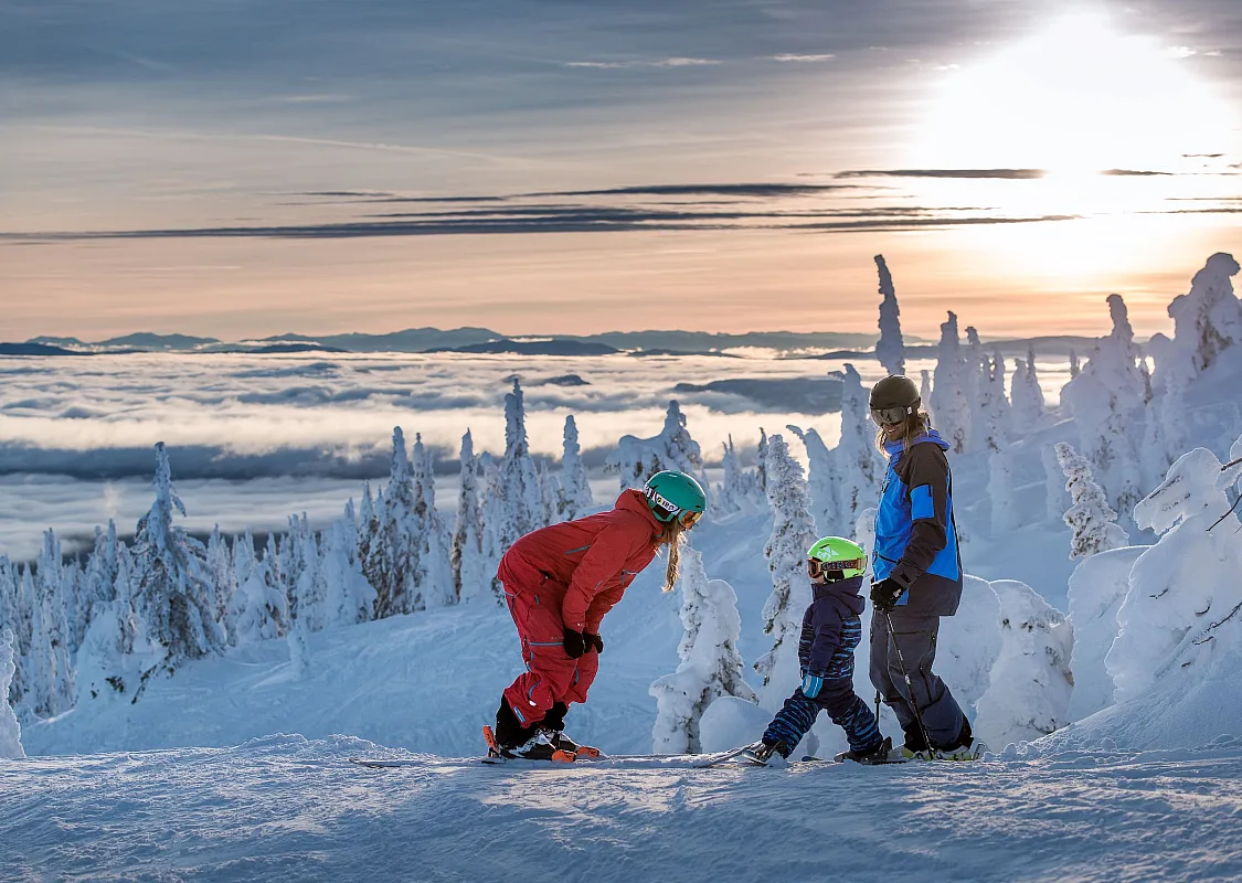 A group downhill skiing at Big White Ski Resort