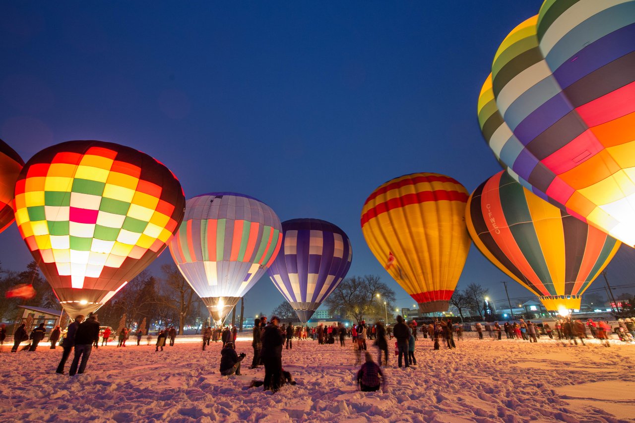 People gathering at a hot air balloon festival