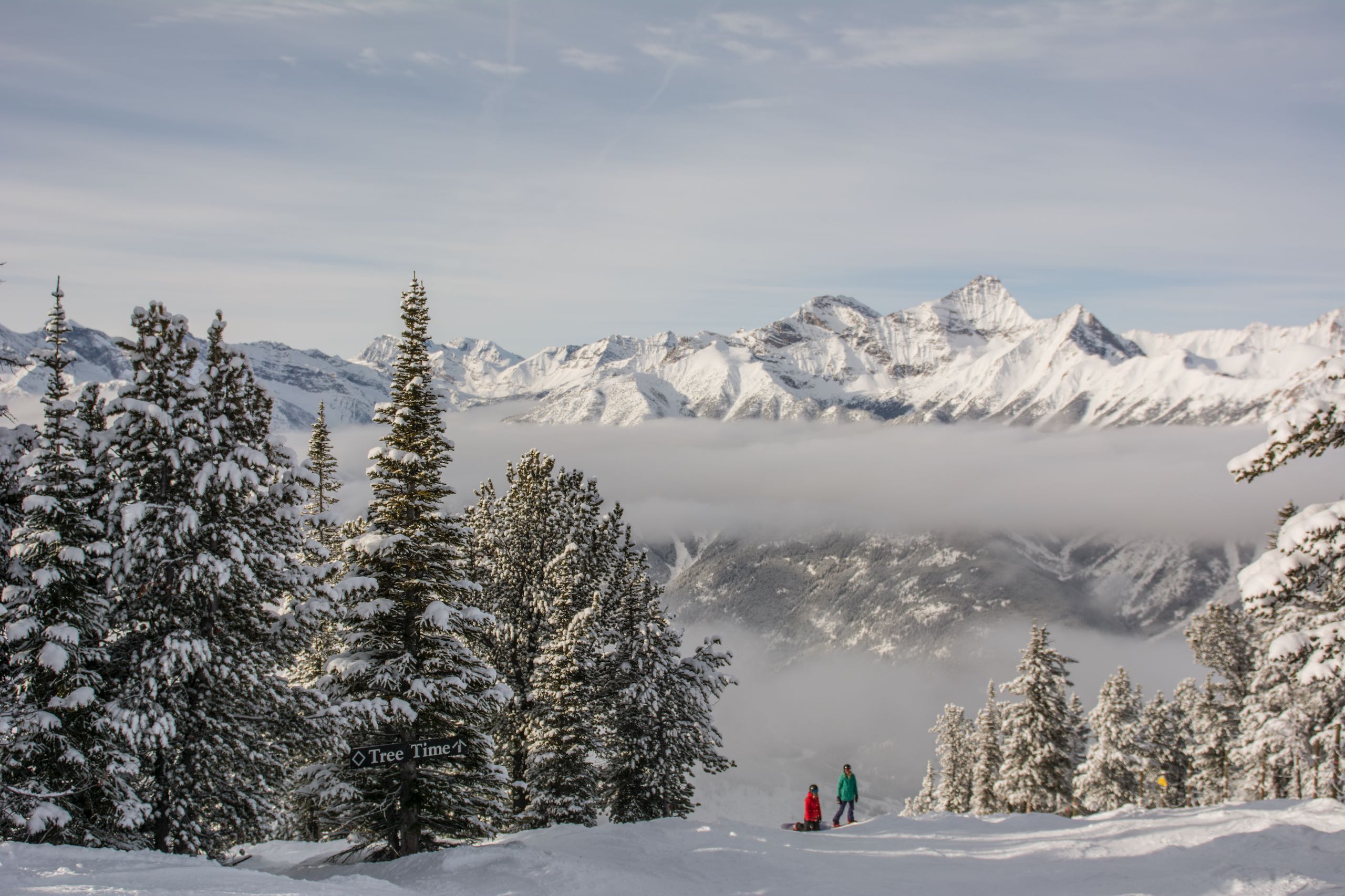 People taking a rest from snowboarding
