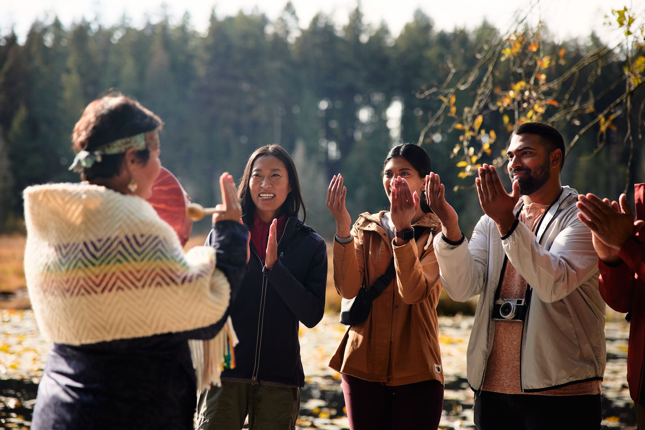 An Indigenous guide leads a walking tour through Stanley Park.
