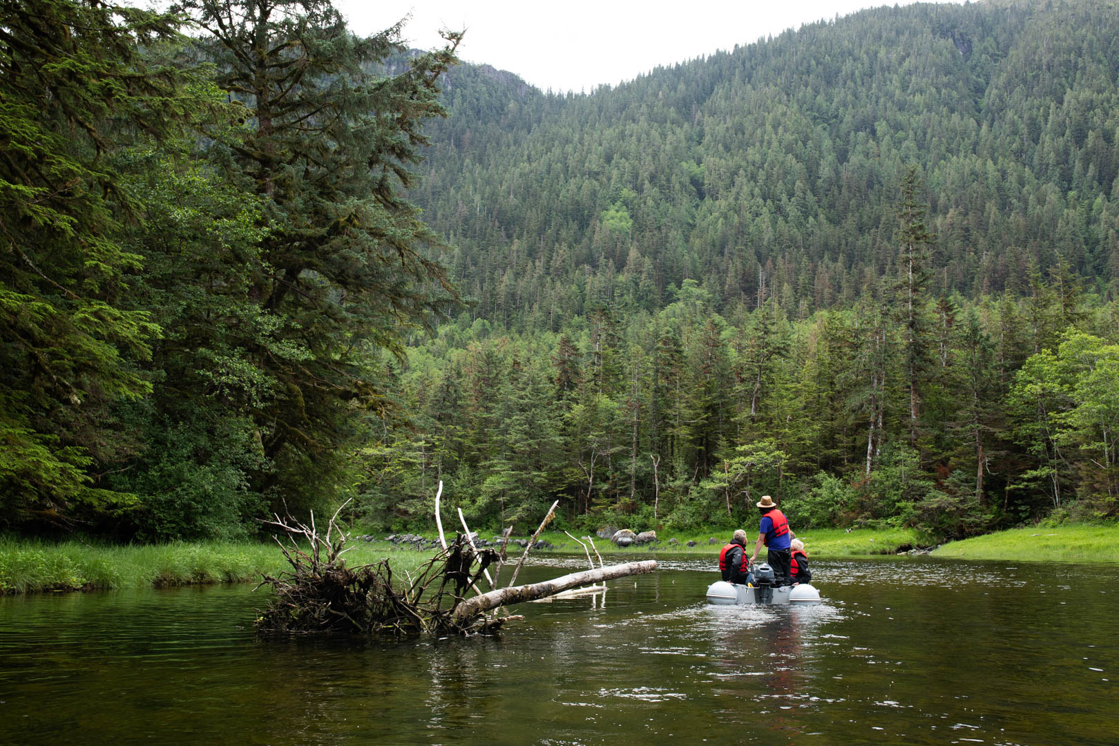 People in a boat floating on a river