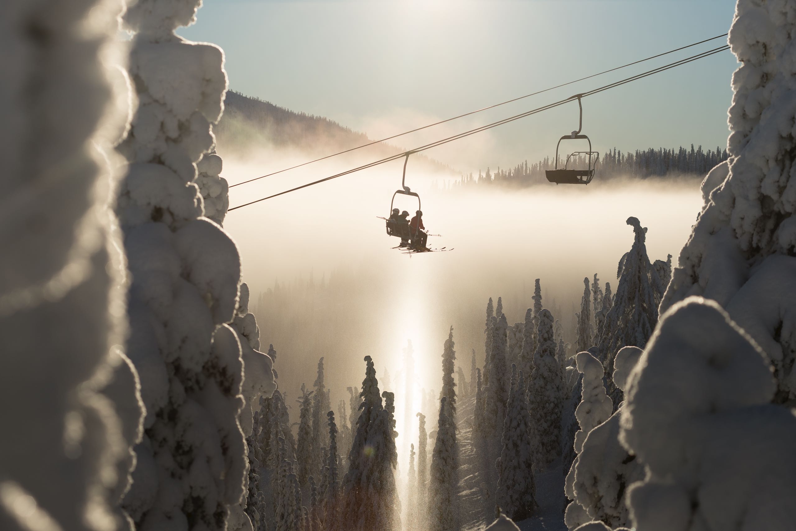 Skiers on the chairlift at Red Mountain Resort