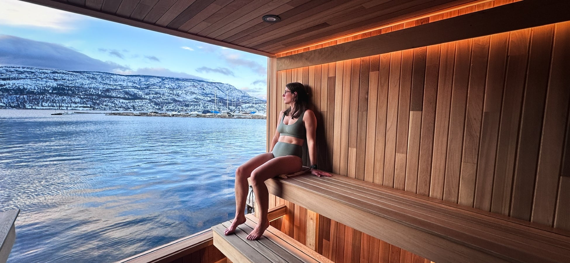 Guest relaxing in Löyly floating sauna in Kelowna, Löyly Floating Sauna