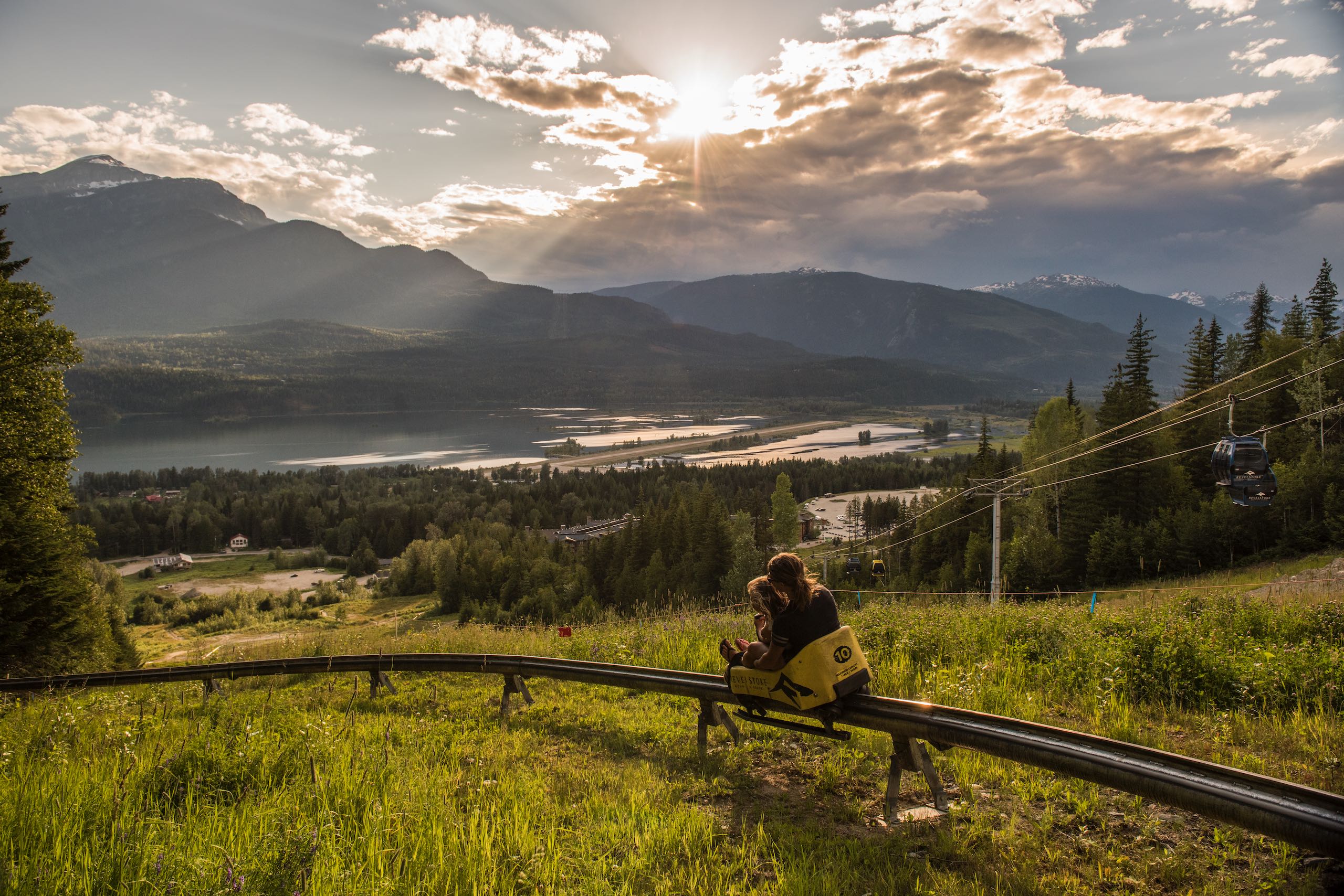 A mother and daughter enjoy The Pipe Mountain Coaster at Revelstoke Mountain Resort in Revelstoke, BC.