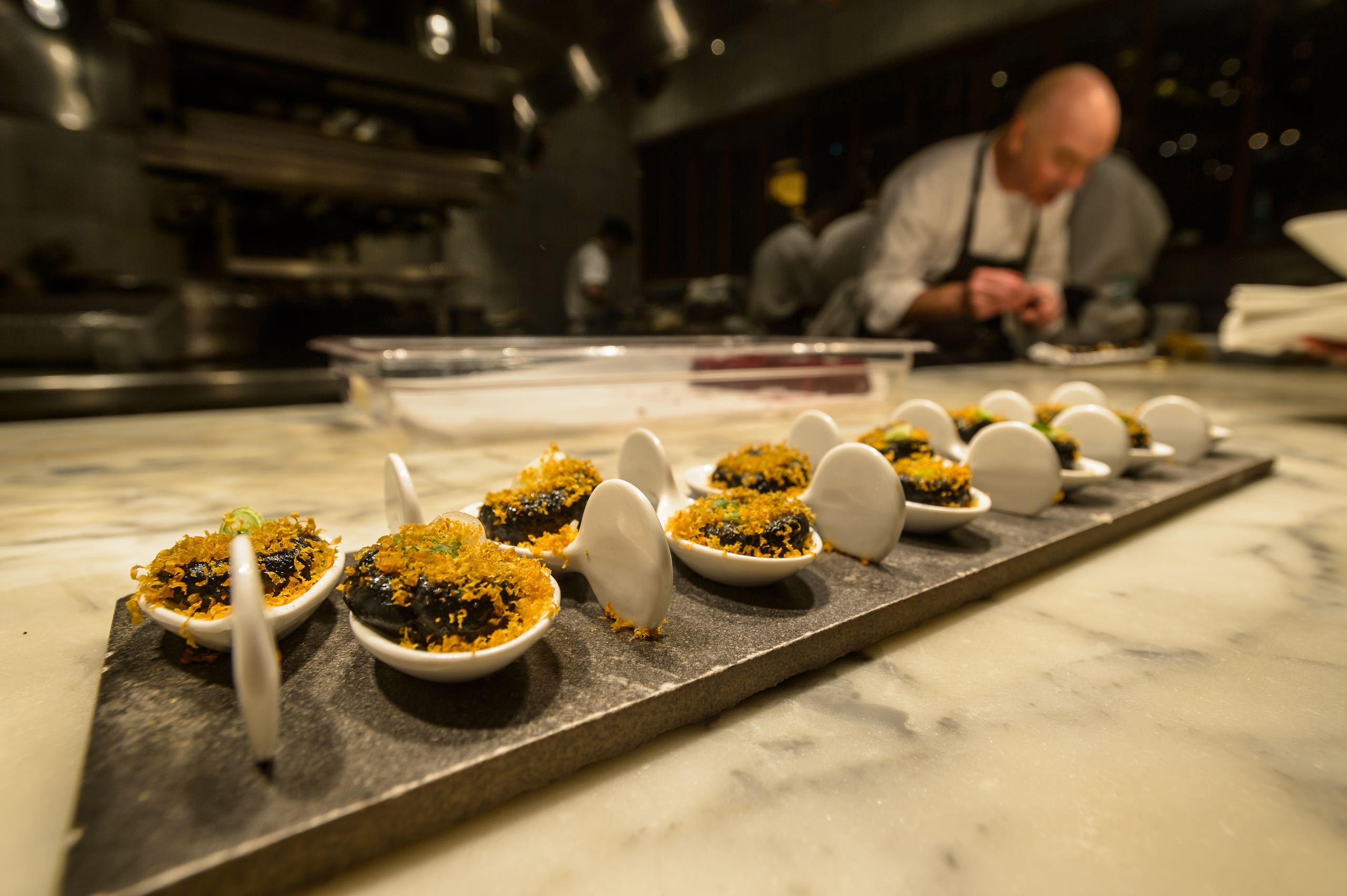 A chef plating good during the Dine Out Vancouver Festival