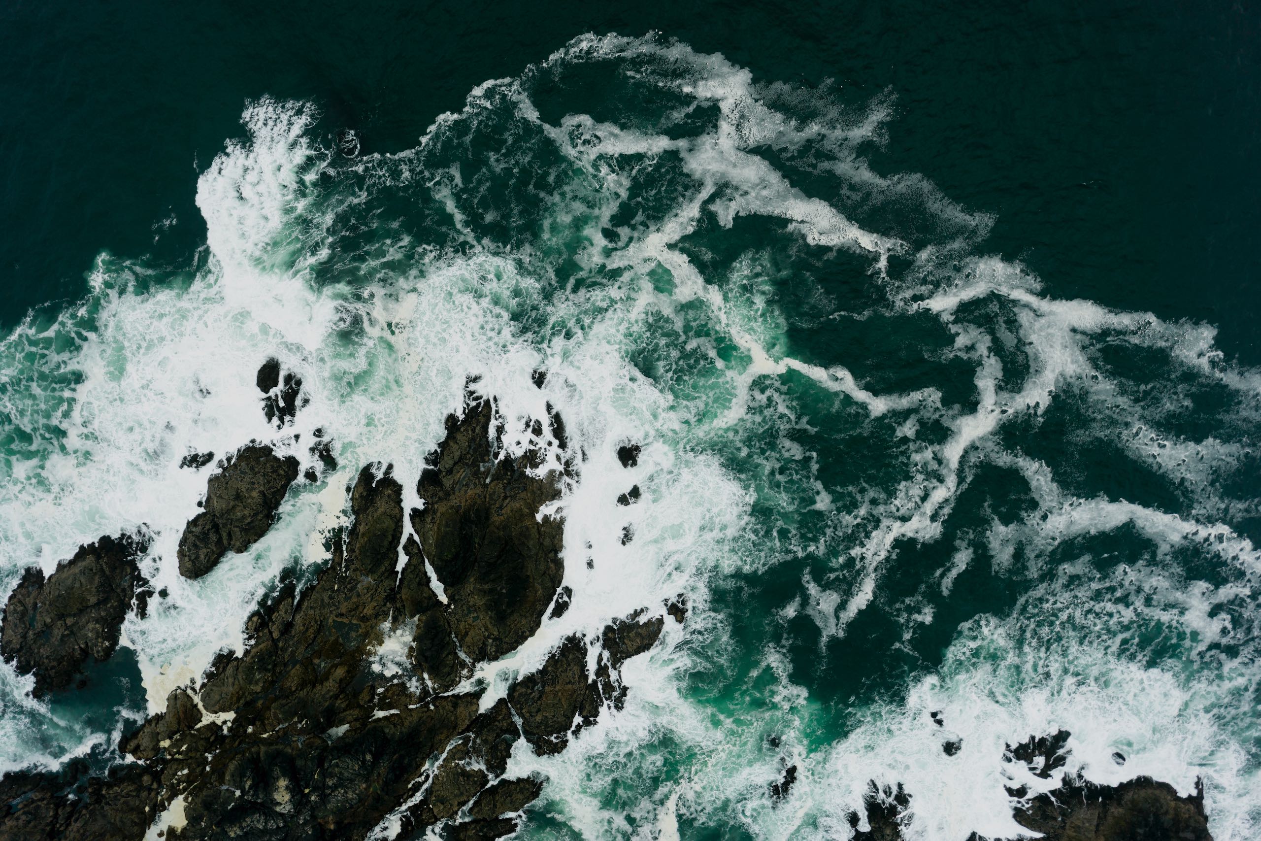 An aerial view of waves crashing against the rocks at Brown's Beach near Ucluelet on Vancouver Island.