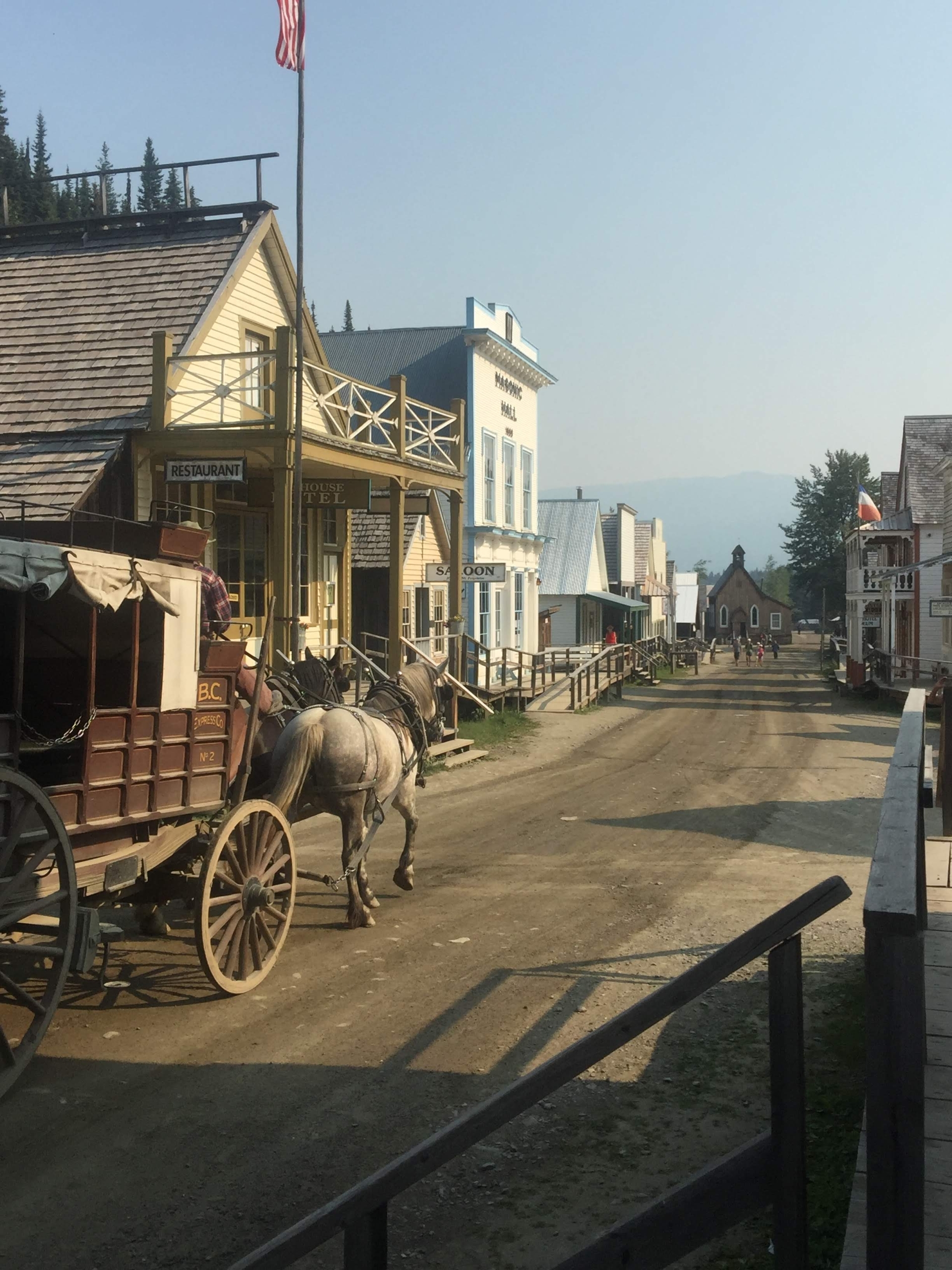 A horse drawn carriage in a town