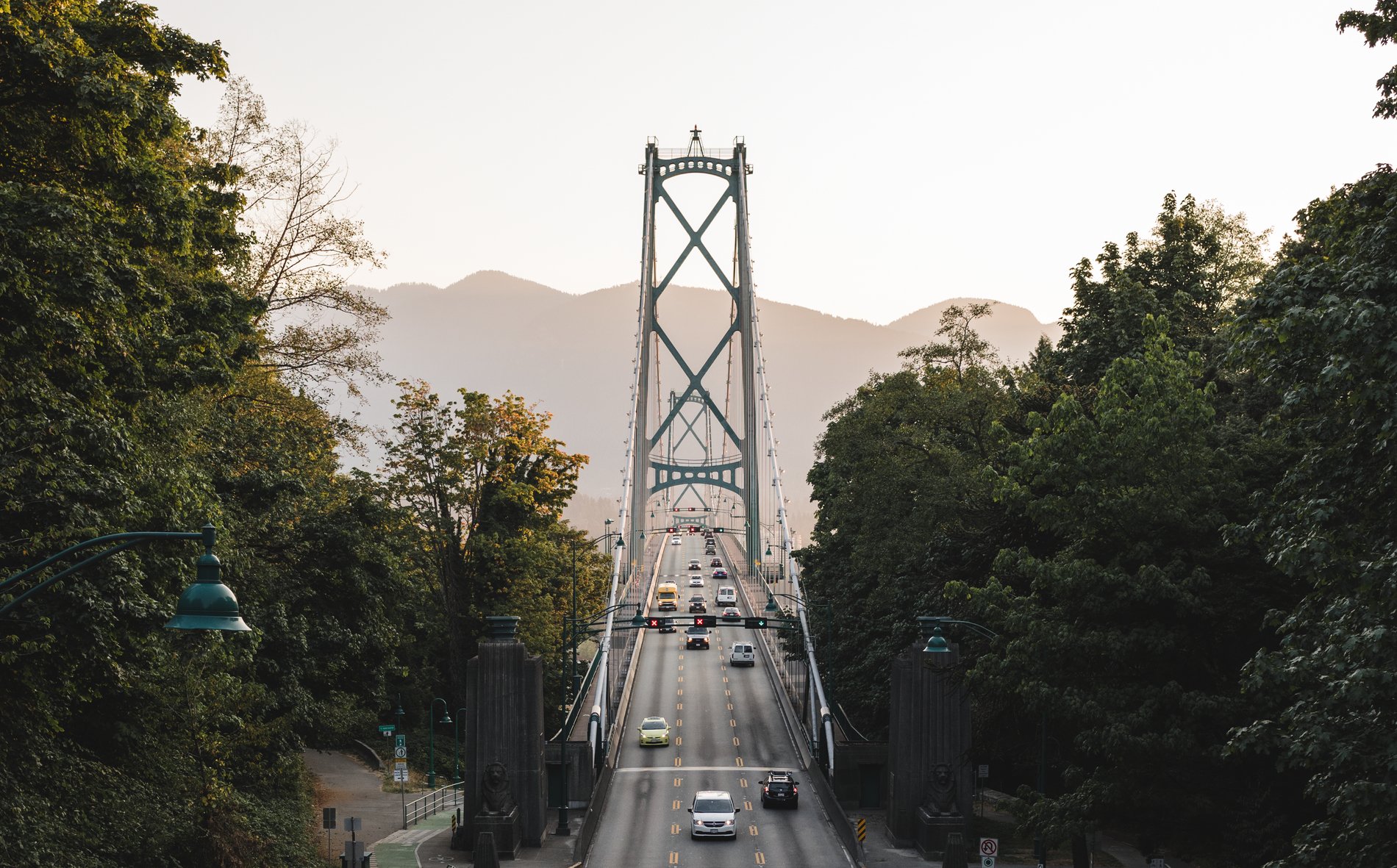 Traffic passing on Lions Gate Bridge with the North Shore mountains in the background