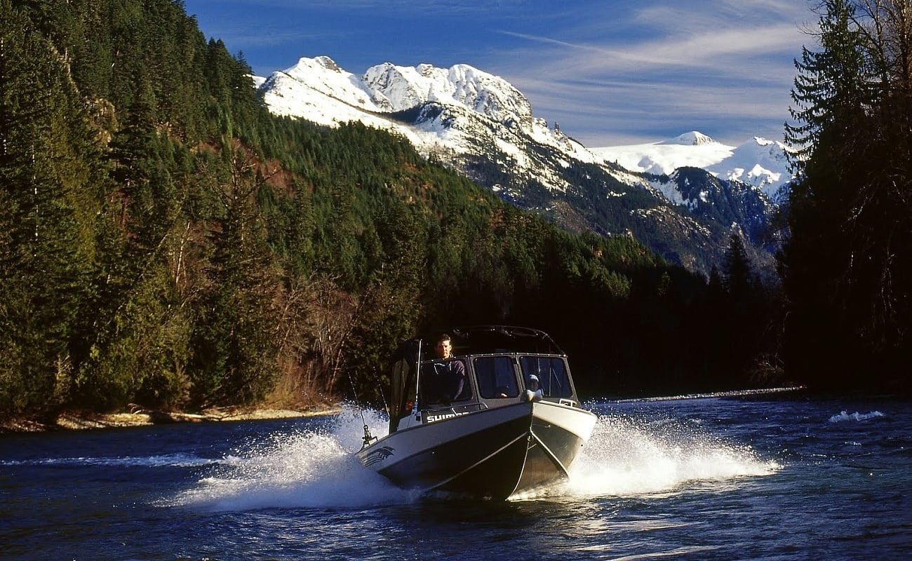 A boat speeds down the lake at Harrison Lake