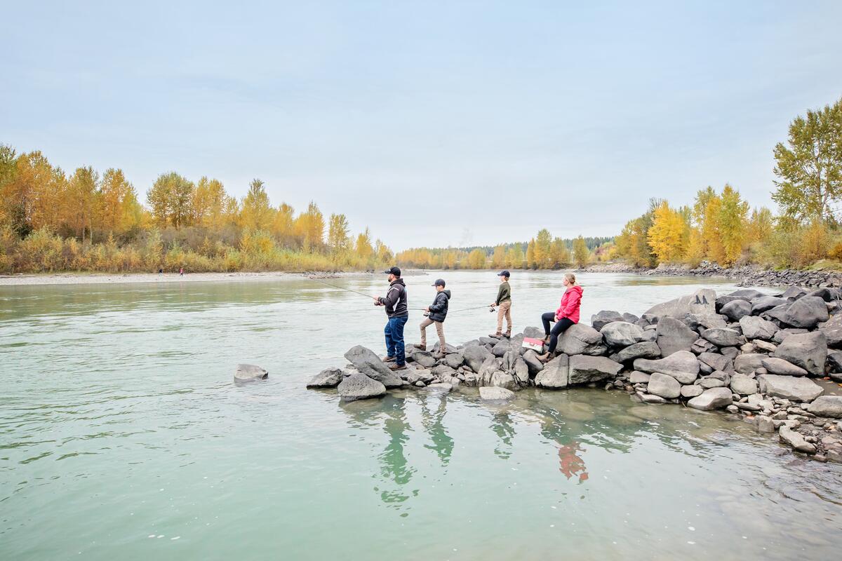 A family fishing on the Quesnel River situated between the Quesnel River Bridge and Johnston Bridge, near downtown Quesnel