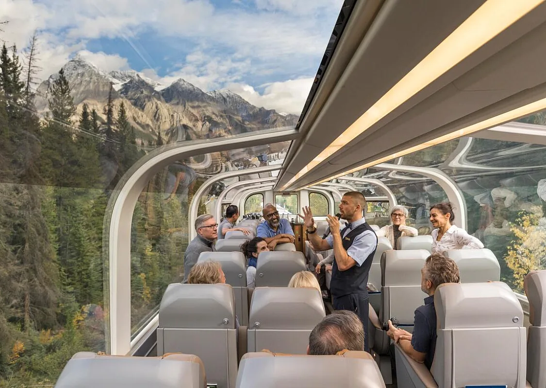 View out of the wrap-around dome windows on a luxury train.