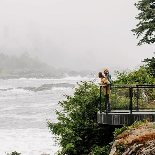 Two people taking in the ocean views at Black Rock Oceanfront Resort in Ucluelet.