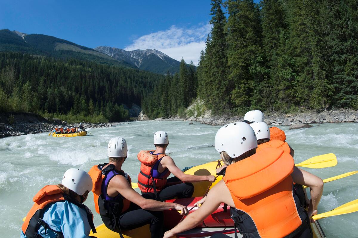 Group whitewater rafting on Kicking Horse River