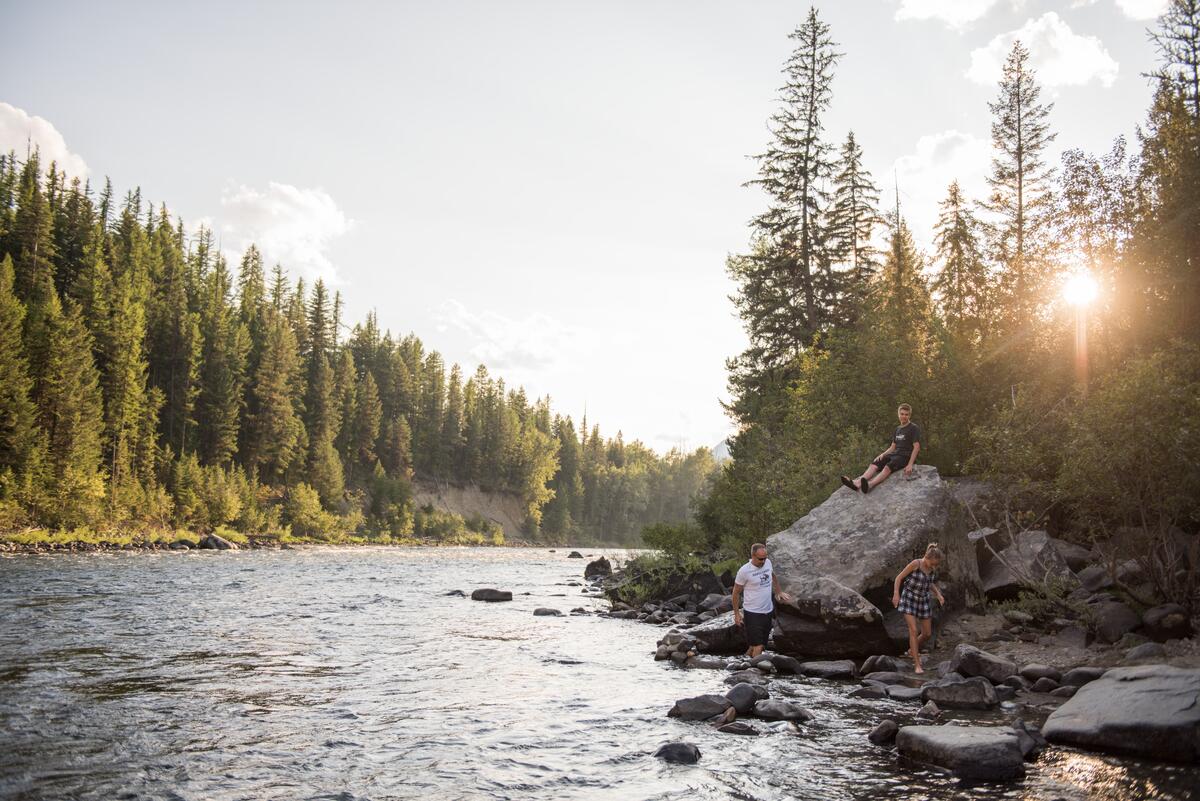 A family on the shores of the St. Mary's River, Kimberley Riverside Campground.