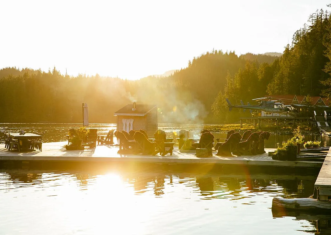 Waterfront view of Nimmo Bay Wilderness Resort at golden hour on Vancouver Island.