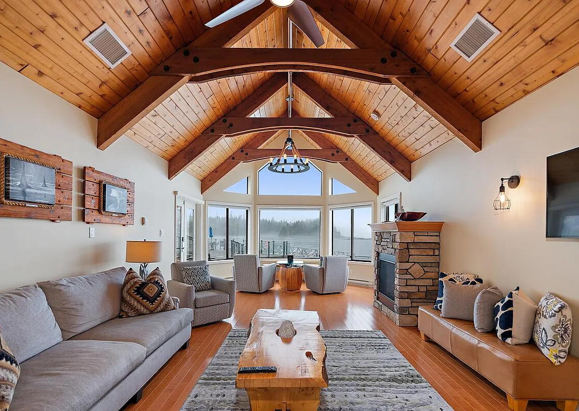 Interior of Marina Lodge featuring vaulted ceilings and waterfront views at Sonora Resort on Sonora Island.
