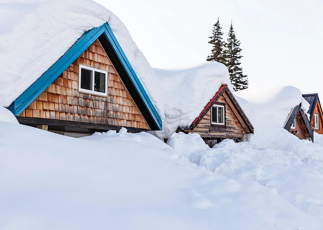 Cabins at Azouzetta Lake Lodge/Powder King Mountain Resort with snow piled as high as the ceiling.