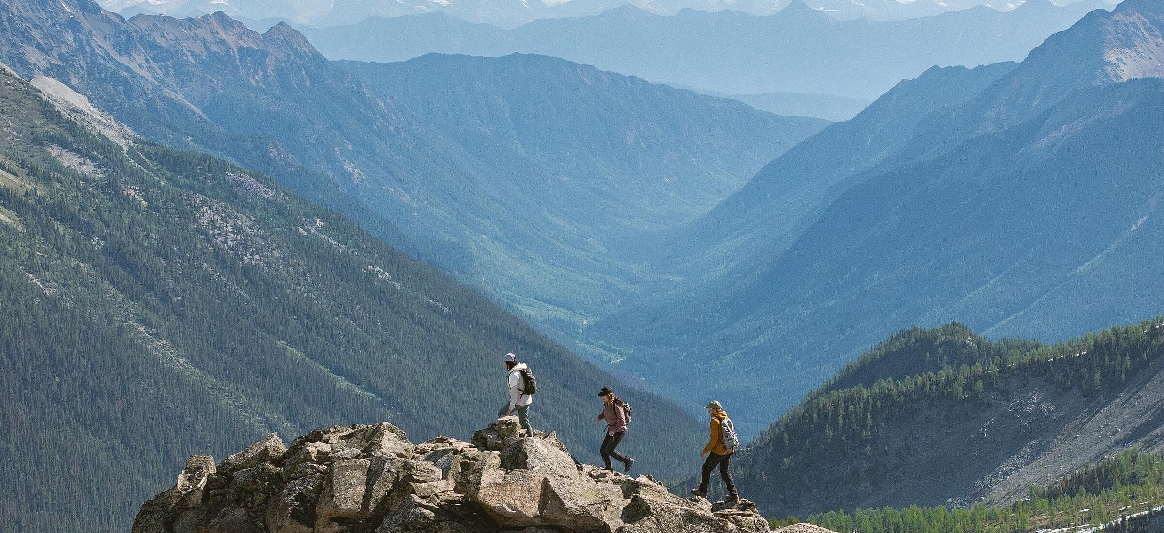 Three friends heli-hiking in the Bugaboos during a guided trip with CMH Bugaboos.