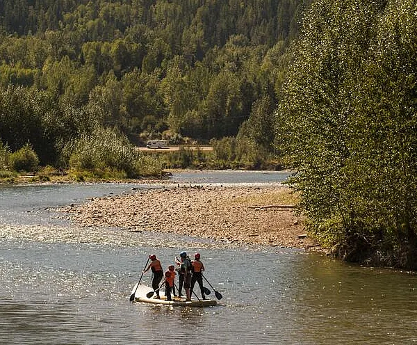 A group on a SUPSquatch river tour with Mountain High Adventures on the Elk River outside of Fernie, BC