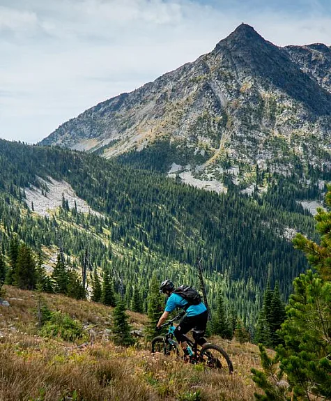 A mountain biker riding the Seven Summits Trail in Rossland.