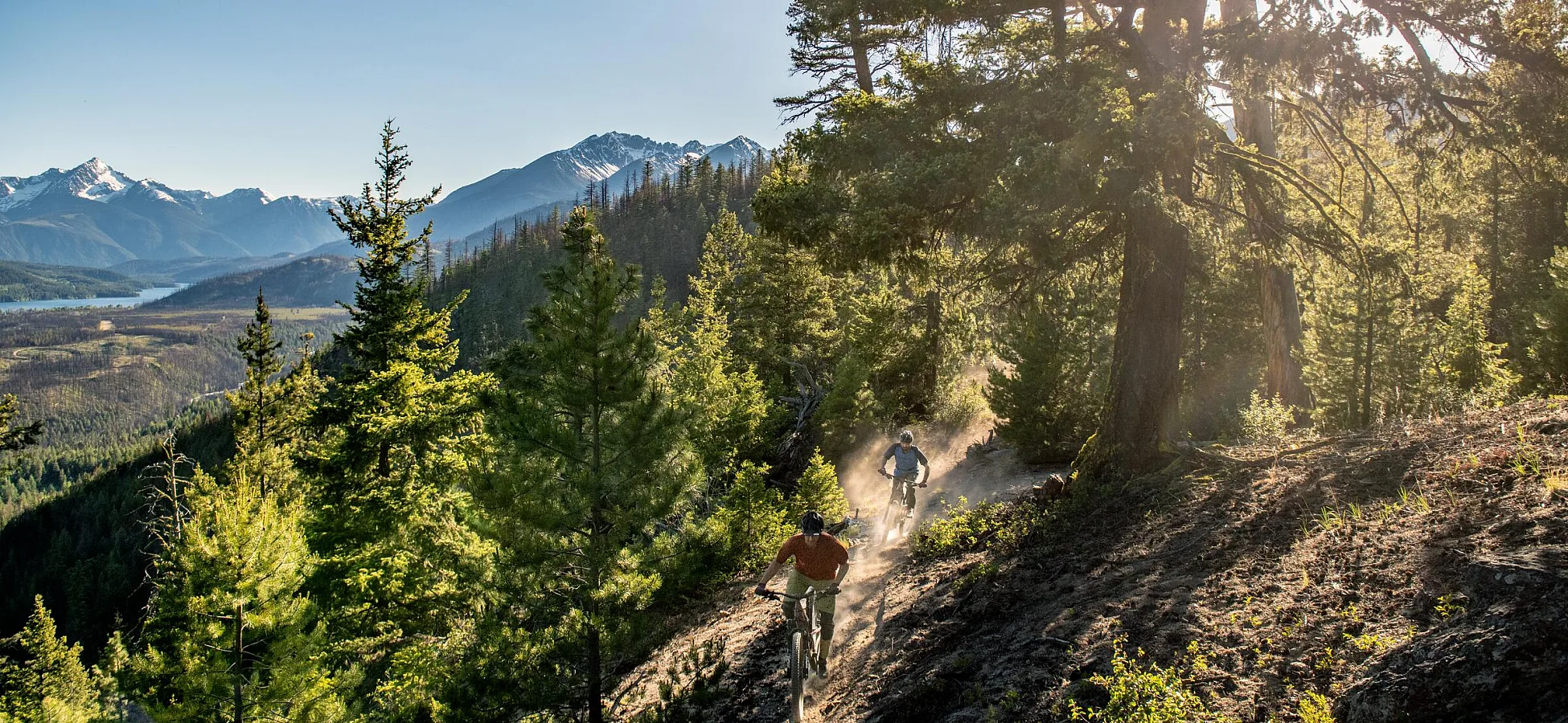 A father and son mountain biking on the trails around Tyax Lodge near Gold Bridge.