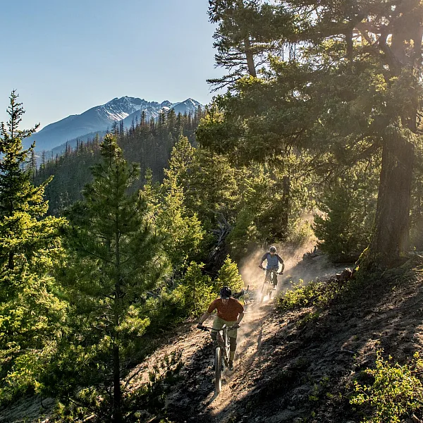 A father and son mountain biking on the trails around Tyax Lodge near Gold Bridge.